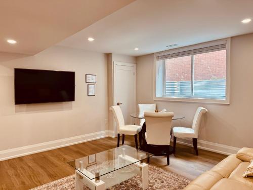 a living room with a couch and a table at 2 Bedroom 1 Parking Basement Unit in Richmond Hill