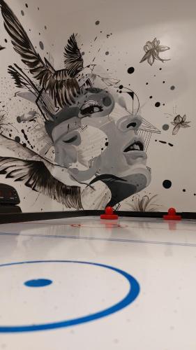 a painting of a fish on the wall of a hockey rink at 2 bedroom apartment lekki Gardens in Ajah in Ikate
