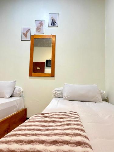Кровать или кровати в номере Rara Guest House Raja Ampat