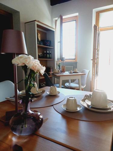 a room with a table with a flower on top of it at ILLASI DREAM ROOMS in Illasi