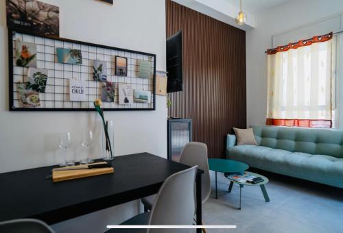 a living room with a couch and a table at Up the Hill in Tiberias