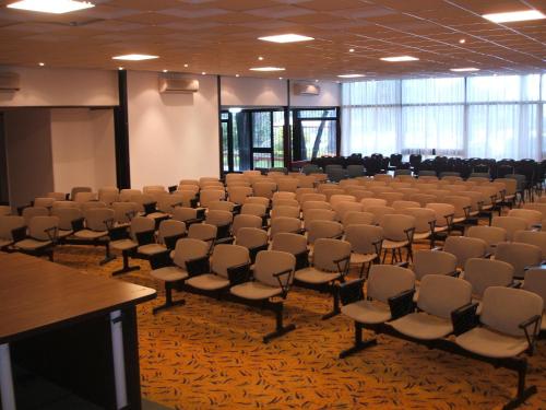 a large room with chairs and a podium in it at El Mirador Hotel & Spa in Colonia del Sacramento