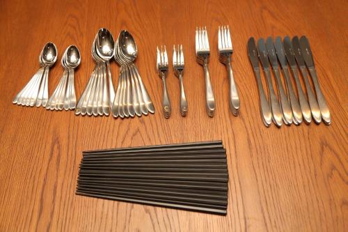 a group of utensils and spoons and forks on a table at FUJI TIME TRAVELER Morino in Fujikawaguchiko