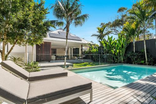 a swimming pool in the backyard of a house at Lady Luxe - Beautiful spacious pet friendly home near the ocean in Byron Bay