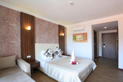 Katil atau katil-katil dalam bilik di Tymnos Hotel