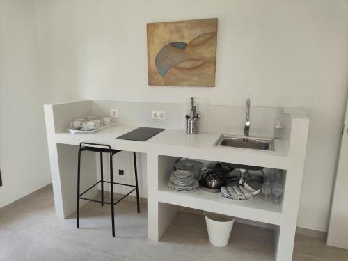 a white desk with a sink in a room at Finca Sol y Mar Es Trenc in Campos