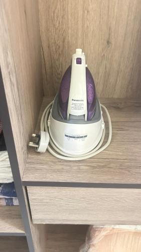 a hair dryer sitting on a shelf in a drawer at Mimi's Nest - Fully furnished, wifi at Tronoh in Teronoh