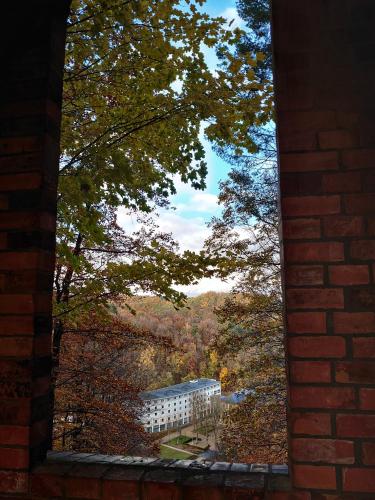 a view of a building from a brick window at Pension im Gesundbrunnental in Bad Freienwalde
