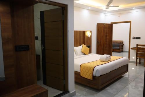 a bedroom with a bed in a room at Rhythm Stays in Munnar