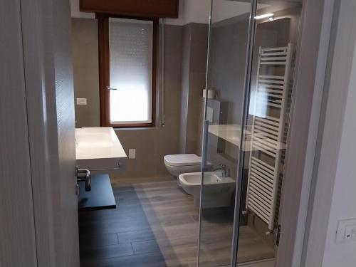a bathroom with a toilet and a sink and a shower at The View 1 in Teglio