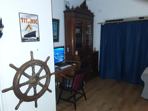 a living room with a steering wheel and a desk at Luxurious 2 bedroom appartment in Antwerp