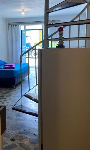 a room with a bunk bed and a bunk ladder at Jardín Aventura in Jardin