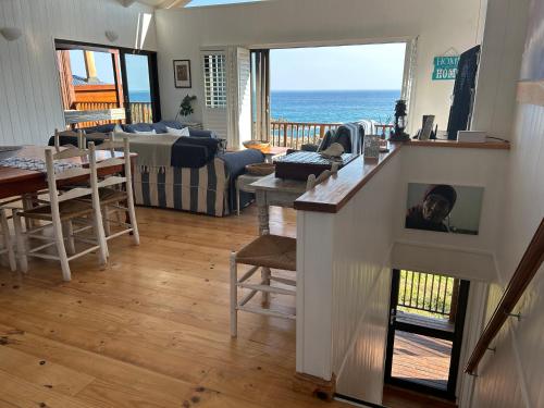 a living room with a view of the ocean at Shick-Shack in Eersterivierstrand