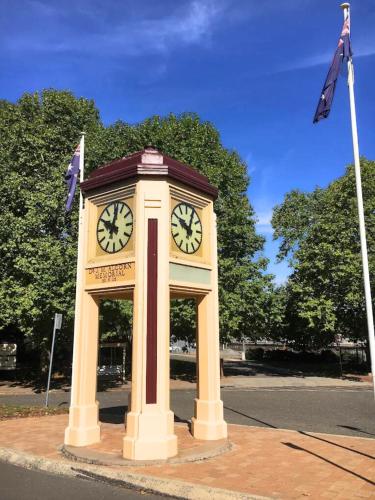 a clock tower in the middle of a street at 2 Bedrooms Minimalist Home in Moss Vale in Moss Vale