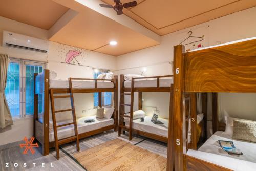 a hostel room with four bunk beds at Zostel Chennai, Anna Nagar in Chennai