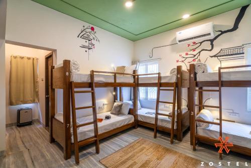 a room with four bunk beds in it at Zostel Chennai, Anna Nagar in Chennai