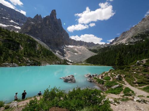 a view of a blue lake in the mountains at Appartmenthotel Residence Elvis in Ortisei