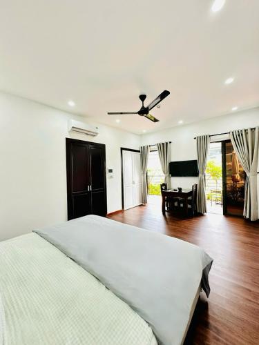 Cama o camas de una habitación en Richico Hoi An Villas