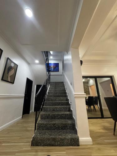 a stairway in a home with a white ceiling at Luxury 3 Bedroom Terrace House in Lekki Phase 1 24hr light & Security in Lekki
