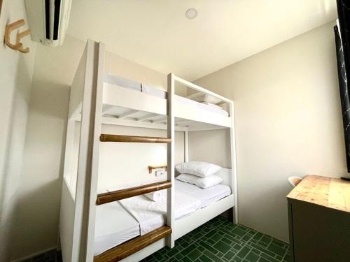 a small room with a bunk bed in it at Chill Out Hostel in Boracay
