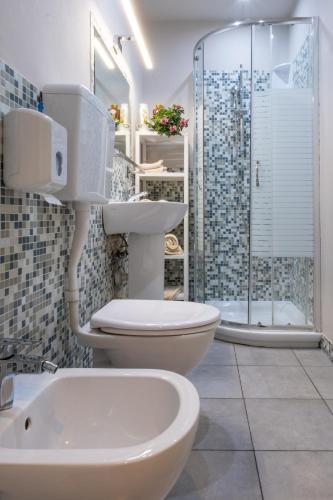 a bathroom with a toilet and a sink and a shower at B&B Accademia in Verona