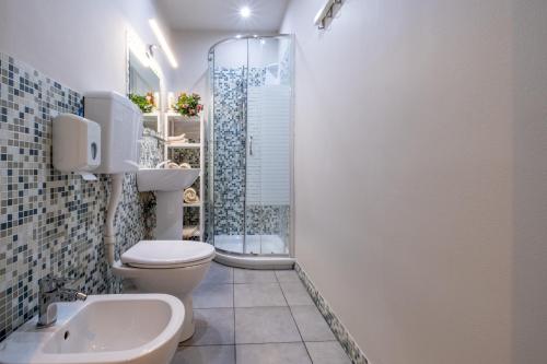 a bathroom with a shower and a toilet and a sink at B&B Accademia in Verona