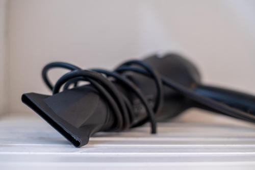 a pair of black headphones sitting on a keyboard at B&B Accademia in Verona
