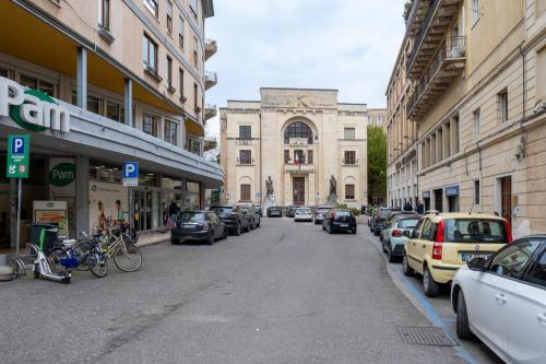 a city street with parked cars and a building at B&B Accademia in Verona