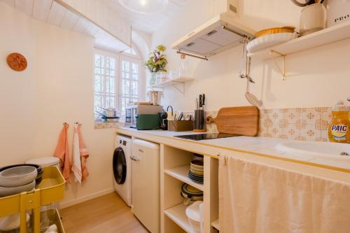 a kitchen with a sink and a counter top at Les Fontaines Saint-Paul-de-Vence Free Parking in Saint-Paul-de-Vence