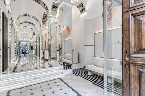 a hallway of a store with a door at The Spotlight Boutique Hotel in Rome
