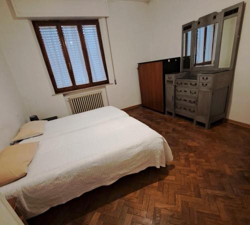 Ένα ή περισσότερα κρεβάτια σε δωμάτιο στο Rinidia - Siena Celso Cittadini Grande