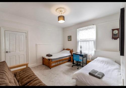 Ένα ή περισσότερα κρεβάτια σε δωμάτιο στο Hollies House