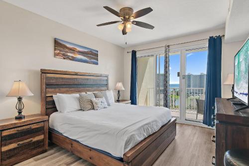 a bedroom with a bed and a ceiling fan at Ariel Dunes II 703 in Destin
