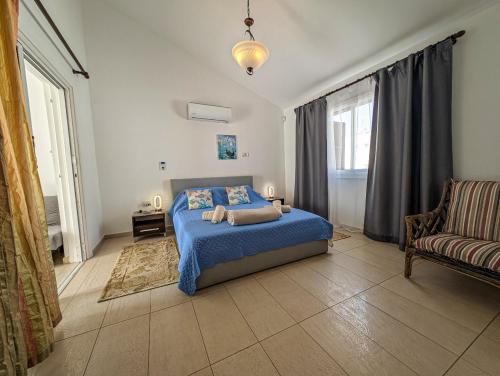 En eller flere senge i et værelse på Fig Tree Bay Villa Elena