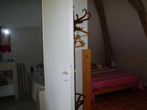 Postel nebo postele na pokoji v ubytování Le Manoir des Prés