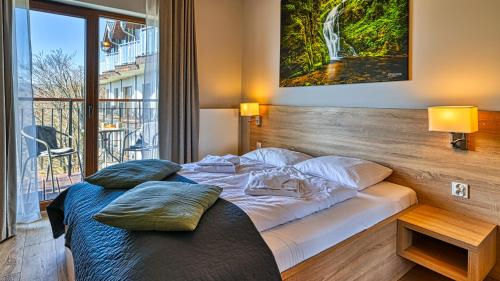 Postel nebo postele na pokoji v ubytování Apartamenty Good Time - Górna Resort