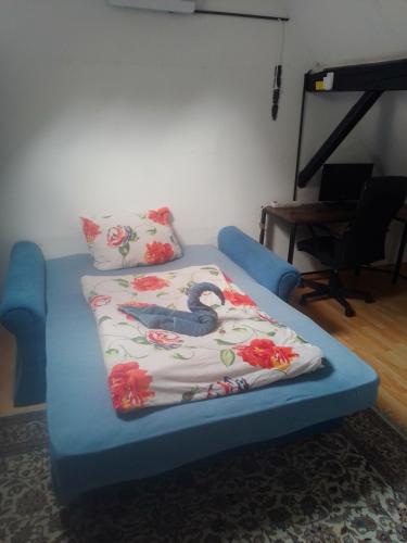 a bed in a room with a blanket on it at Sauerland Holiday House in Olsberg