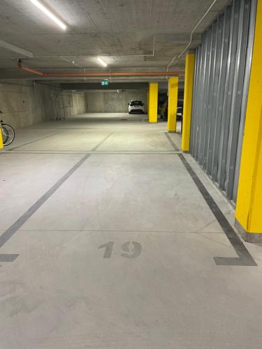 an empty parking garage with a car parked in it at Sunrise Euronia in Międzyzdroje