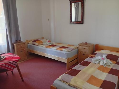 Postel nebo postele na pokoji v ubytování Hagyományőrző és múltidéző porta