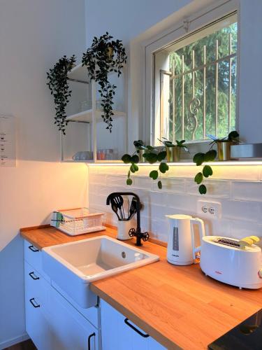 Kuchyň nebo kuchyňský kout v ubytování StayHub-RHO