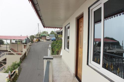 a view of a street from the outside of a building at Nijung Homestay, Dowhill in Kurseong