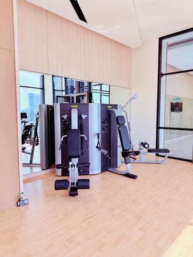a gym with cardio equipment in a large room at Luxury Axon Residence Bukit Bintang KLCC PAVILION By IZ in Kuala Lumpur