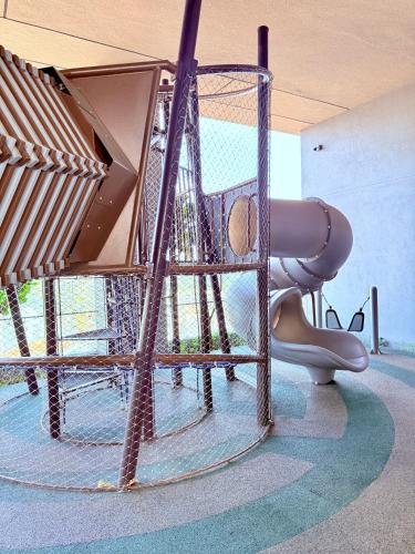 a childrens playground with a slide and a slide at Luxury Axon Residence Bukit Bintang KLCC PAVILION By IZ in Kuala Lumpur