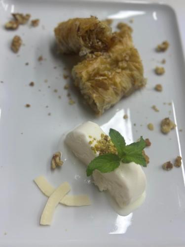a white plate with a dessert with a piece of food at Kandybos Eco Farm Village in Kas
