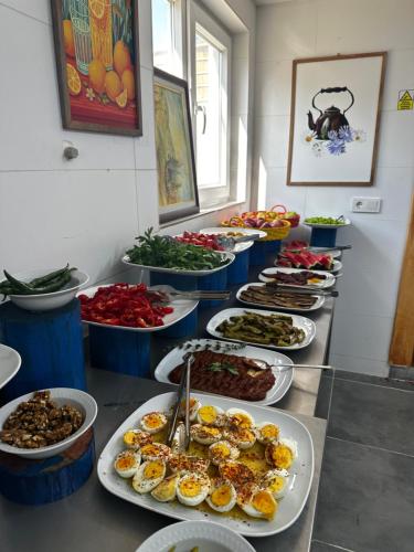 a buffet with many plates of food on a table at Kandybos Eco Farm Village in Kas