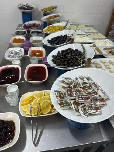 a table with plates of food and bowls of food at Kandybos Eco Farm Village in Kas