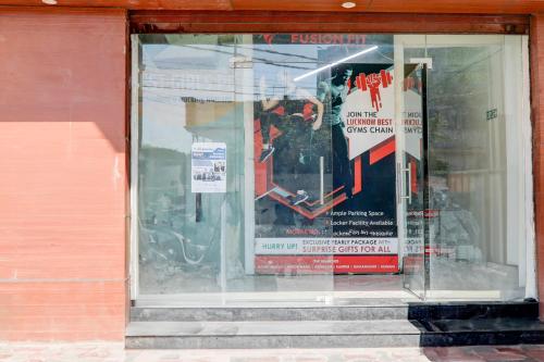 a display window of a store with signs in it at Hotel O KAILASHA INN in Hasanganj