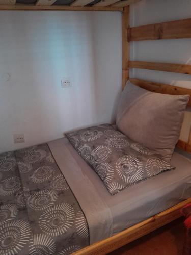 two bunk beds in a room with a pillow at hostel four seasons in Tetouan
