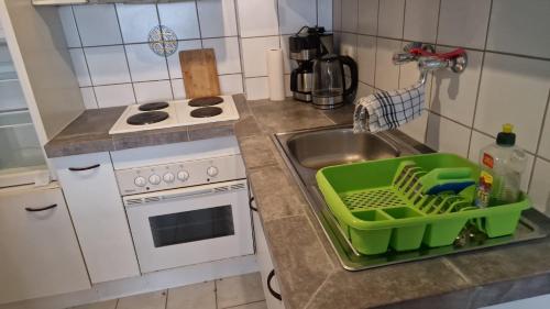 a small kitchen with a sink and a stove at Apartment in Innenstadtnähe in Darmstadt