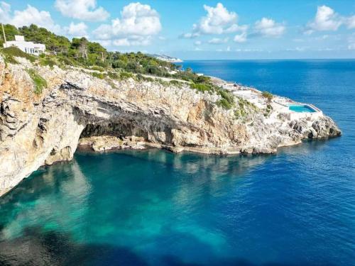 an aerial view of a rocky island in the ocean at Sunset House in Castro di Lecce